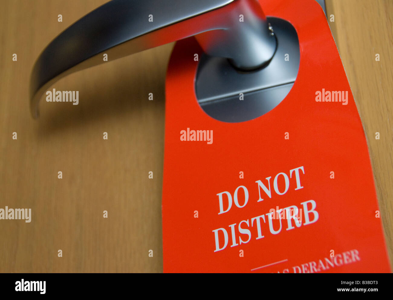 Do Not Disturb sign on a hotel door handle Stock Photo
