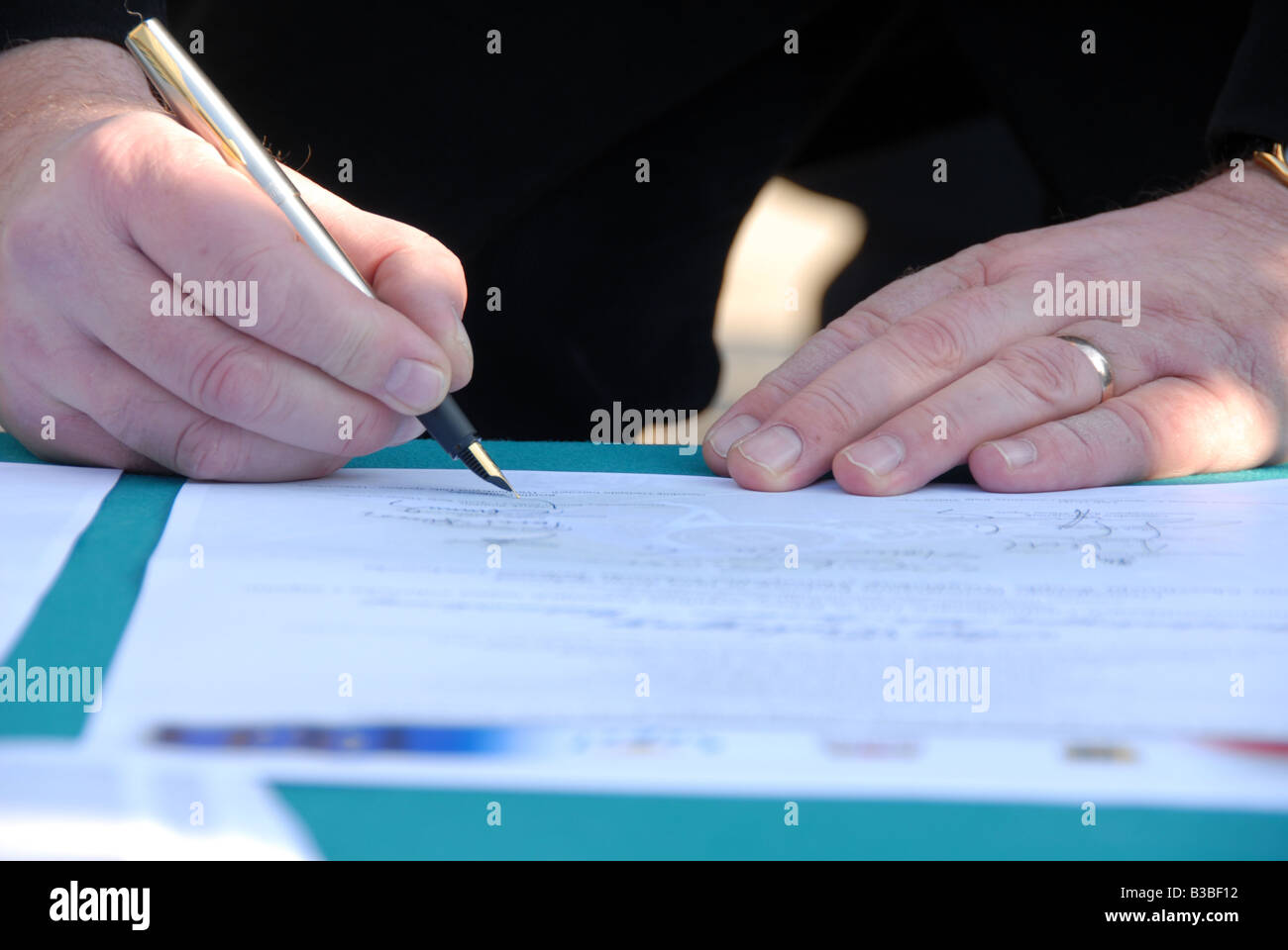 businessman signing document Stock Photo