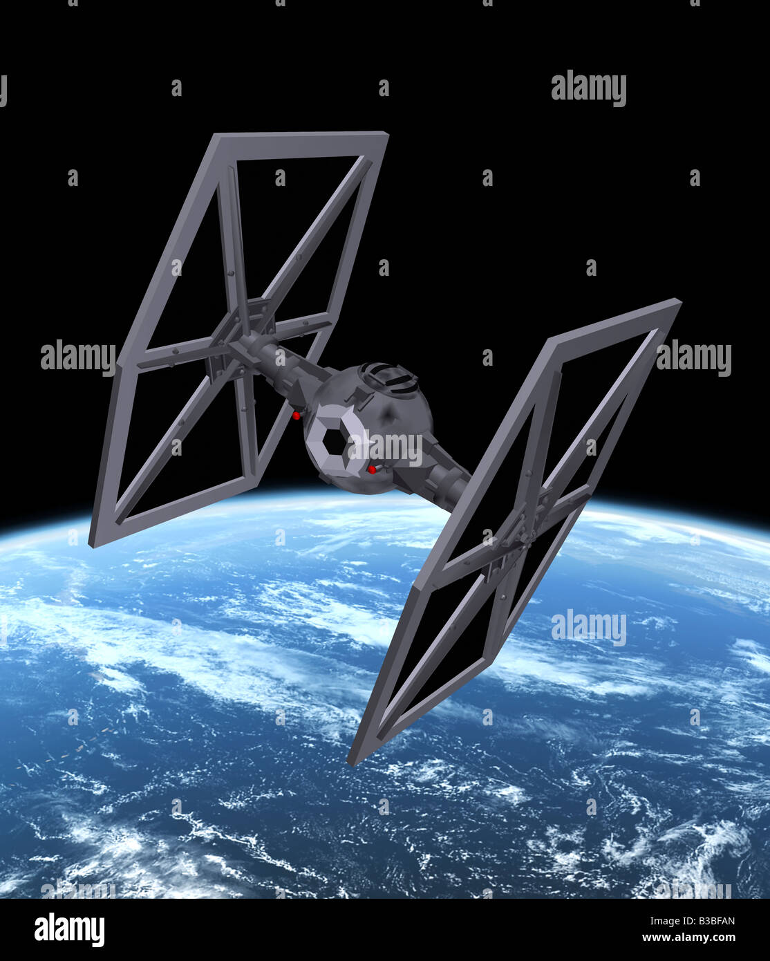 computer enhanced fictional spacecraft TIE fighter in outer space Stock Photo
