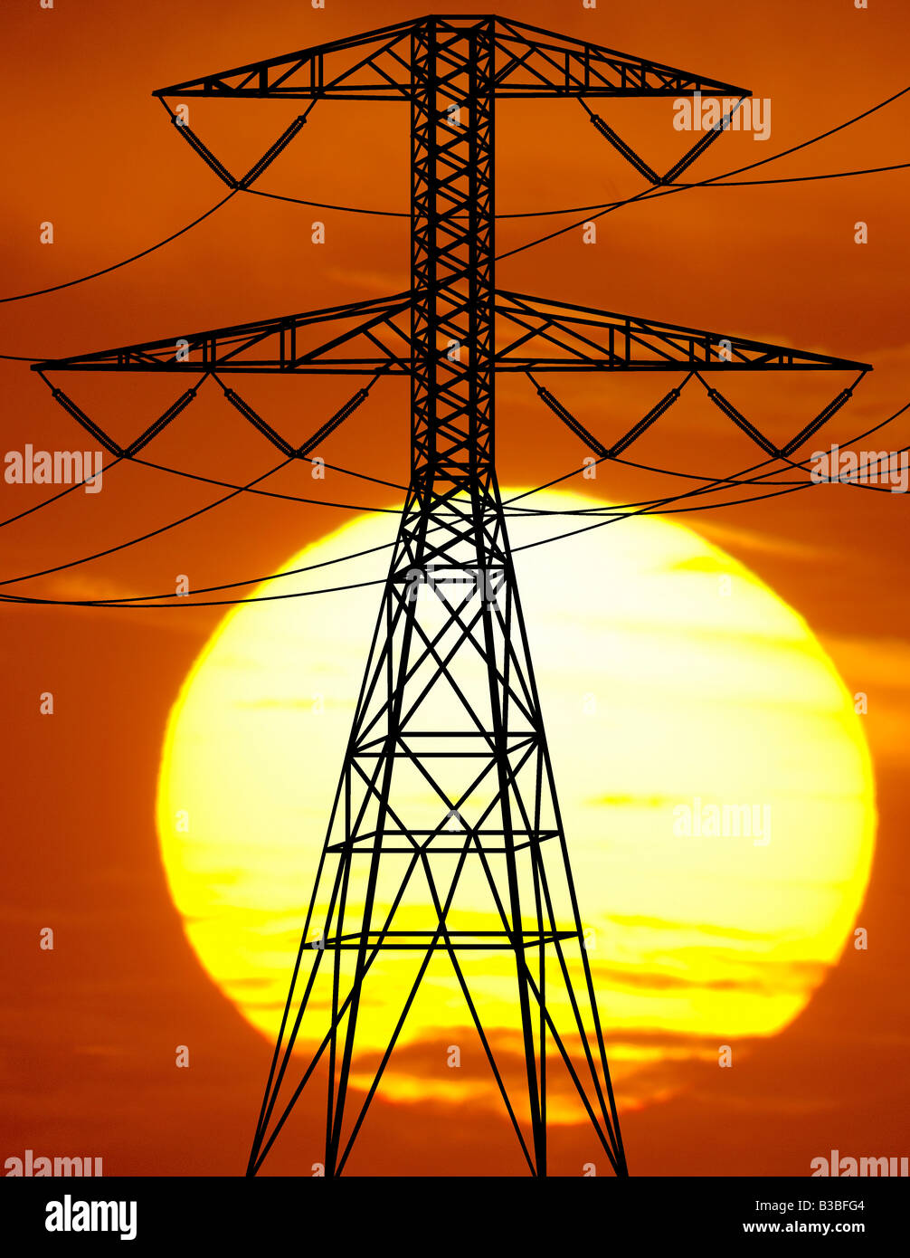 transmission power line tower at sunset Stock Photo