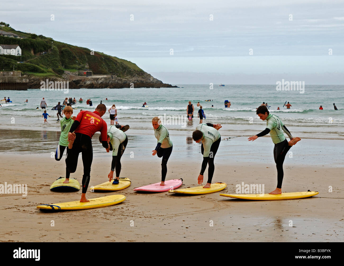 teenagers attending a surf school at newquay in cornwall,england,uk Stock Photo