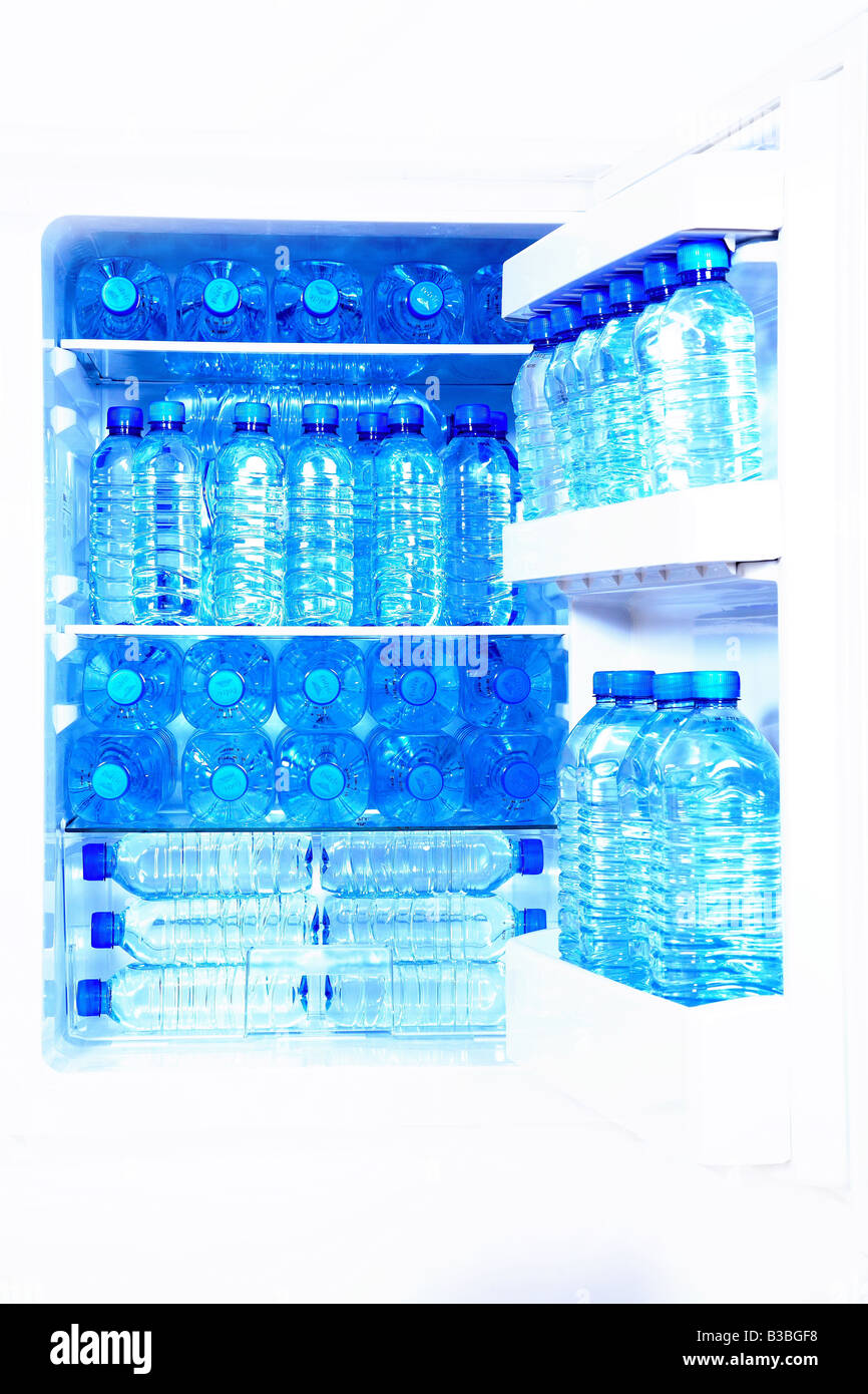Bottles of water in a refrigerator cold blue effect Stock Photo