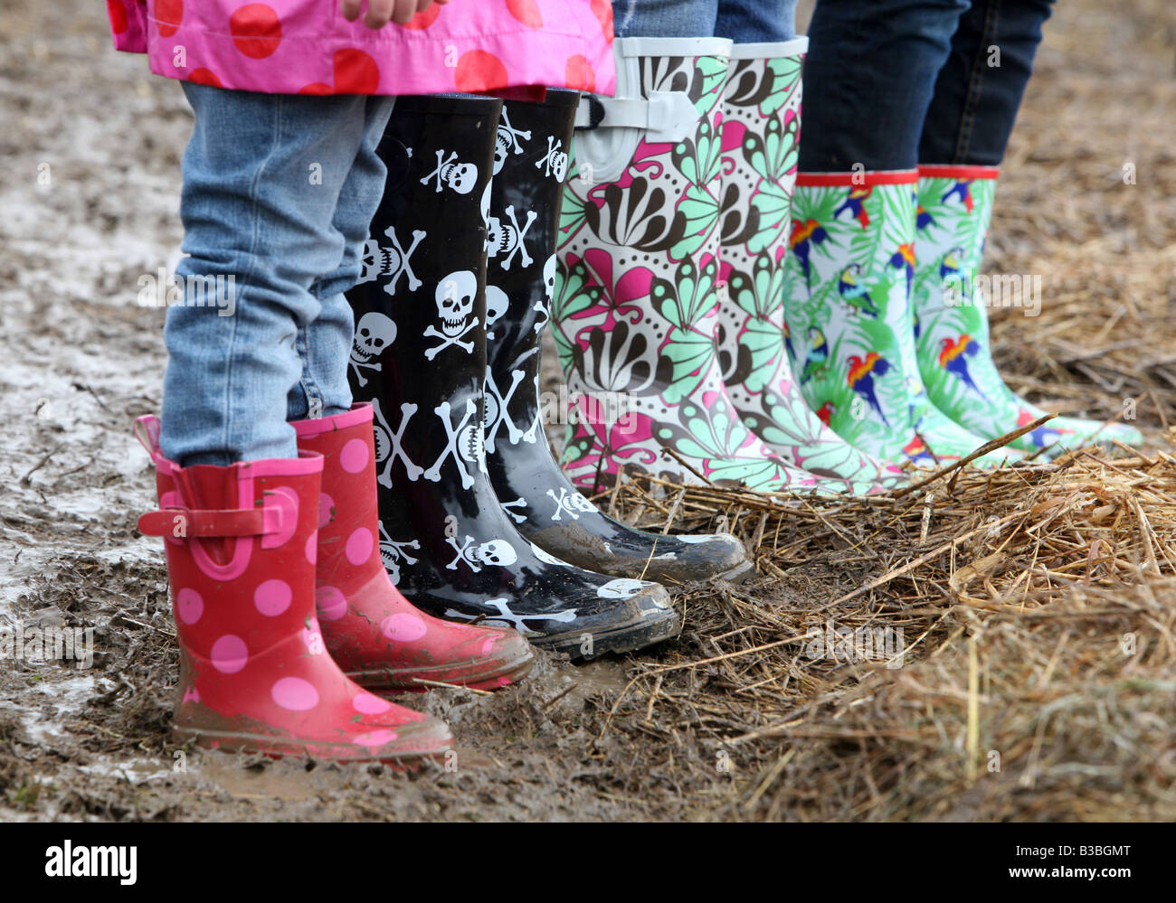 Colourful wellington boots in the mud at the V Festival in Hylands Park  Chelmsford Essex Stock Photo - Alamy