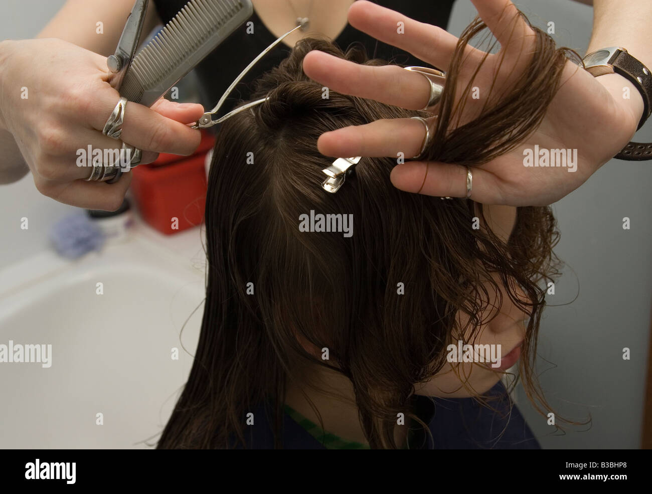 Woman stylist cutting child s hair Stock Photo Alamy