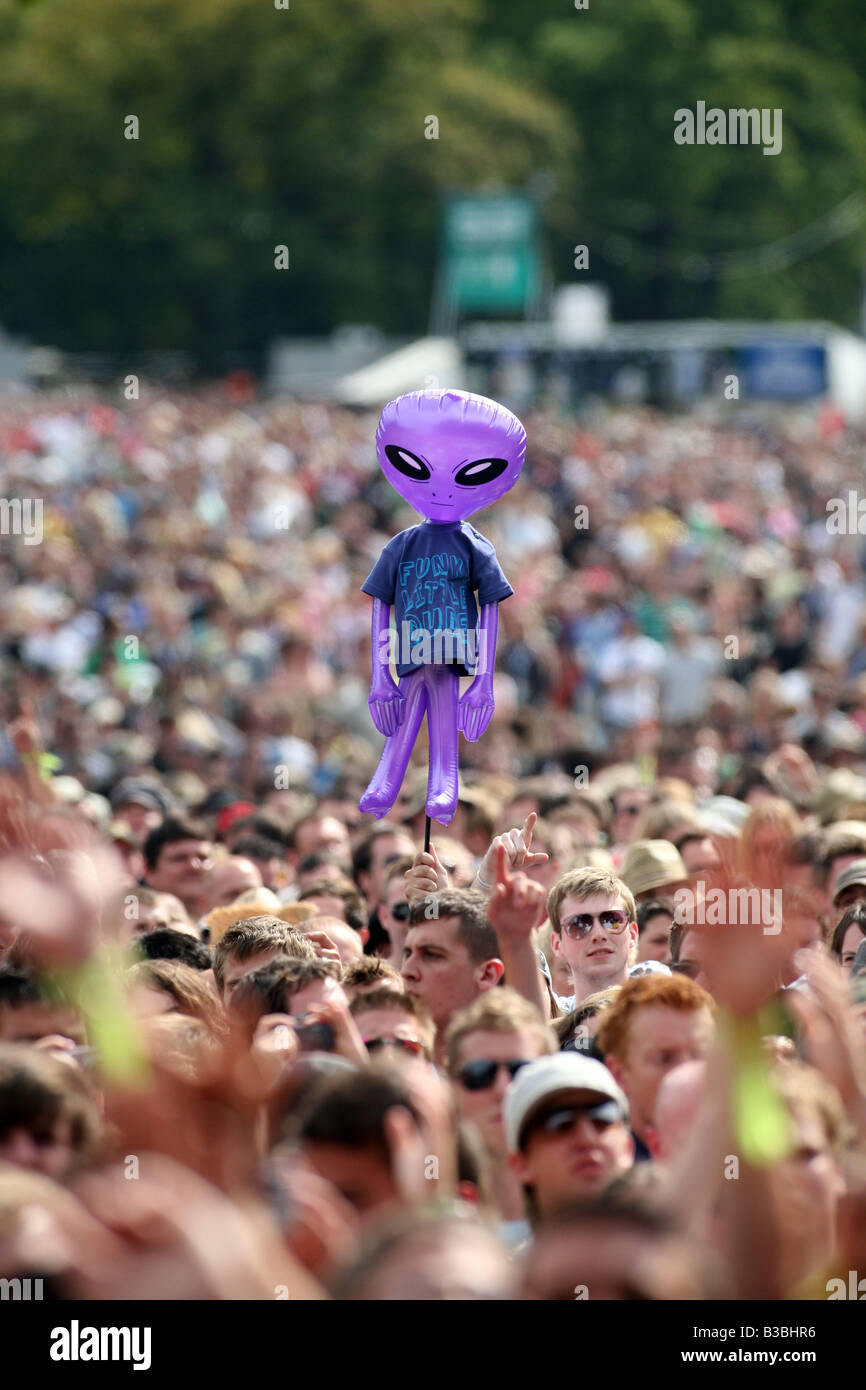 An inflatable alien in the crowd at V Festival in Hylands Park Chelmsford Essex Stock Photo