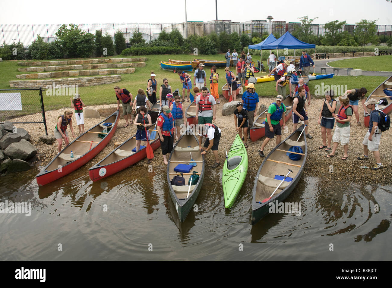 City dwellers prepare to take a canoe trip up the Bronx River in the