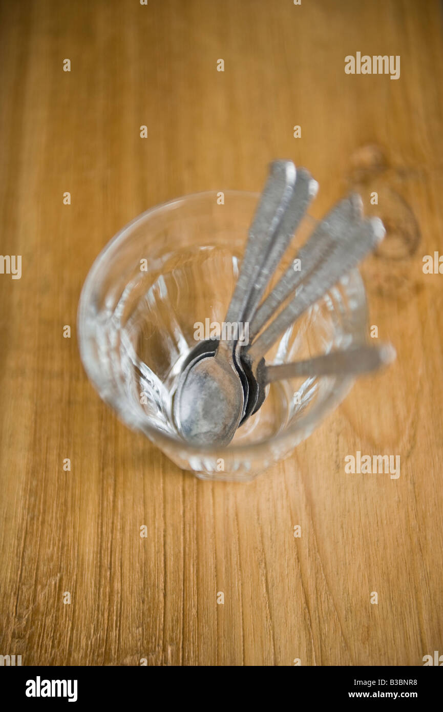 Spoons in glass Stock Photo - Alamy