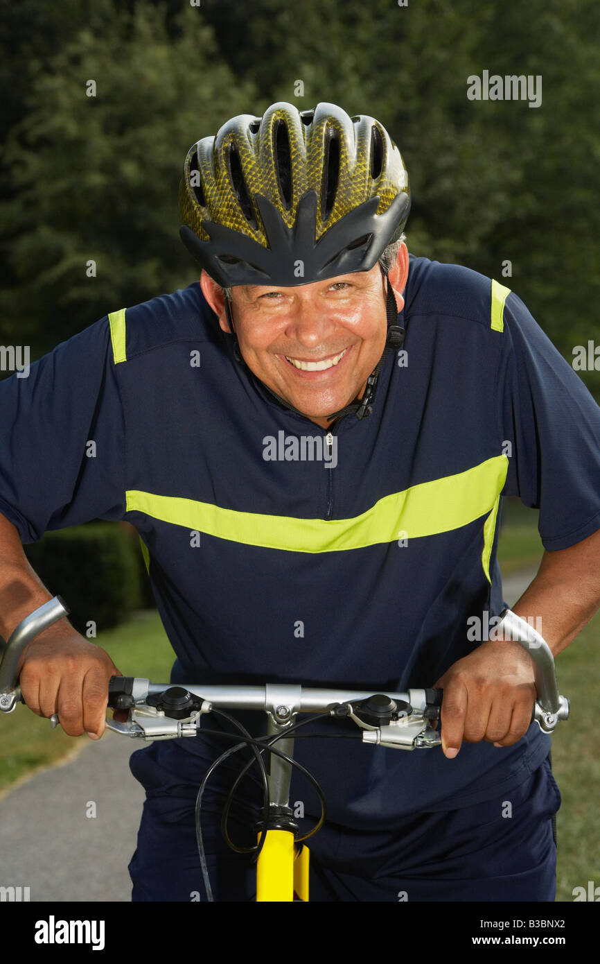 Hispanic Man Riding Bike Hispanic man riding bicycle Stock Photo - Alamy