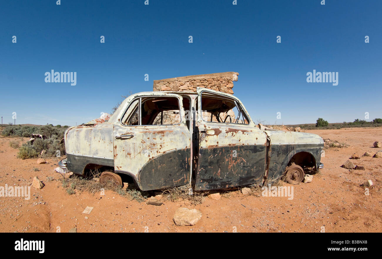 old car in the desert slowly rusts away Stock Photo - Alamy