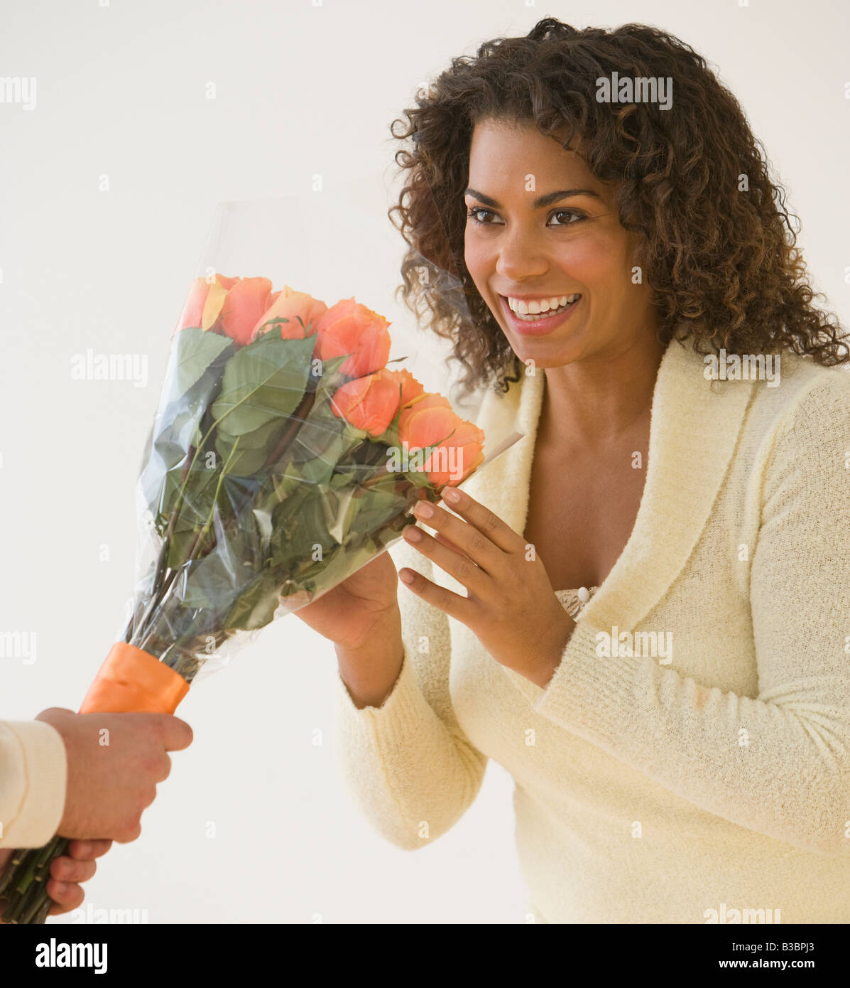 African woman receiving bouquet of flowers Stock Photo Alamy