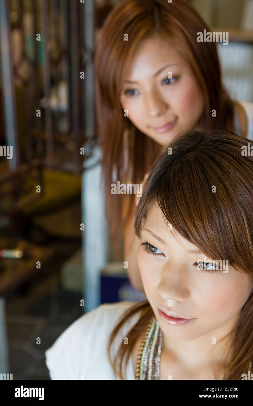 Applying makeup and asian woman hi-res stock photography and images - Alamy