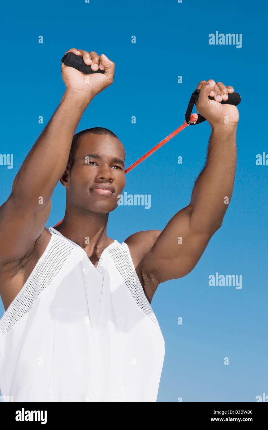 African man stretching with exercise band Stock Photo Alamy