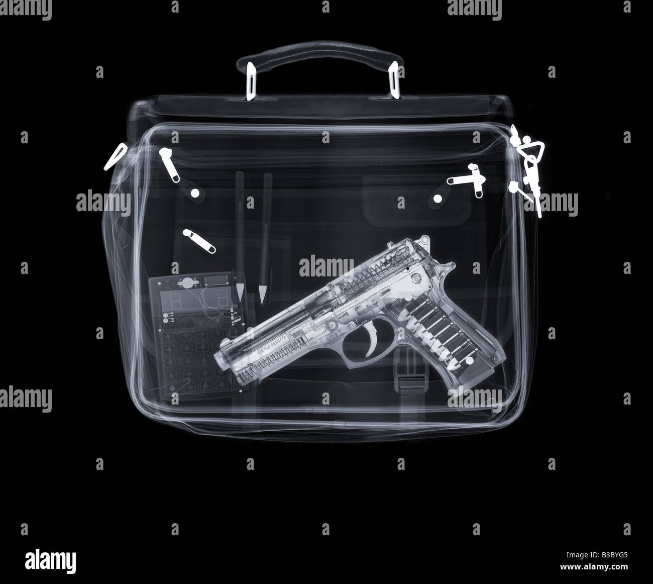 X-ray of a bag containing a gun, pens and a calculator Stock Photo - Alamy