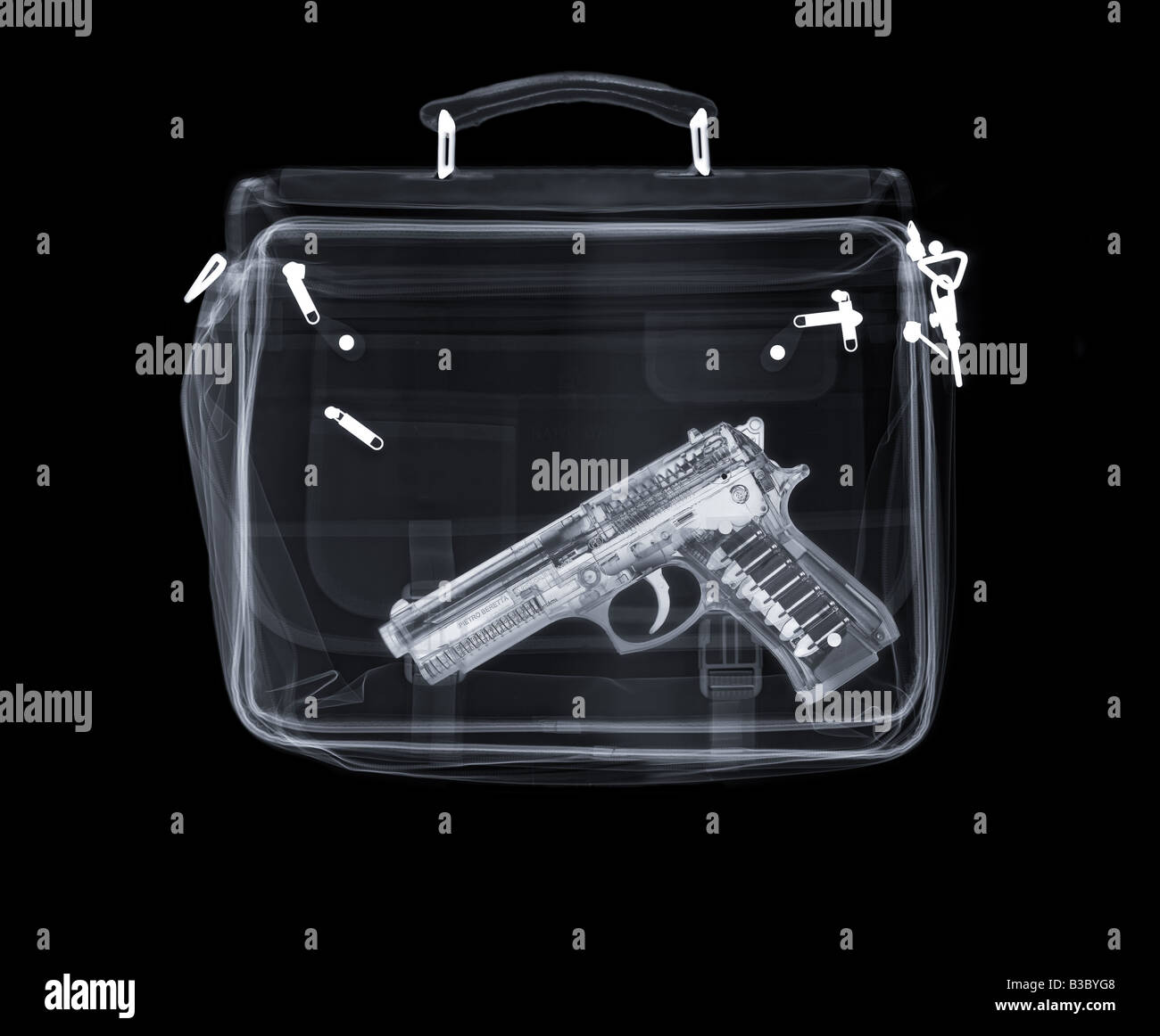 Xray of a bag containing a gun Stock Photo Alamy