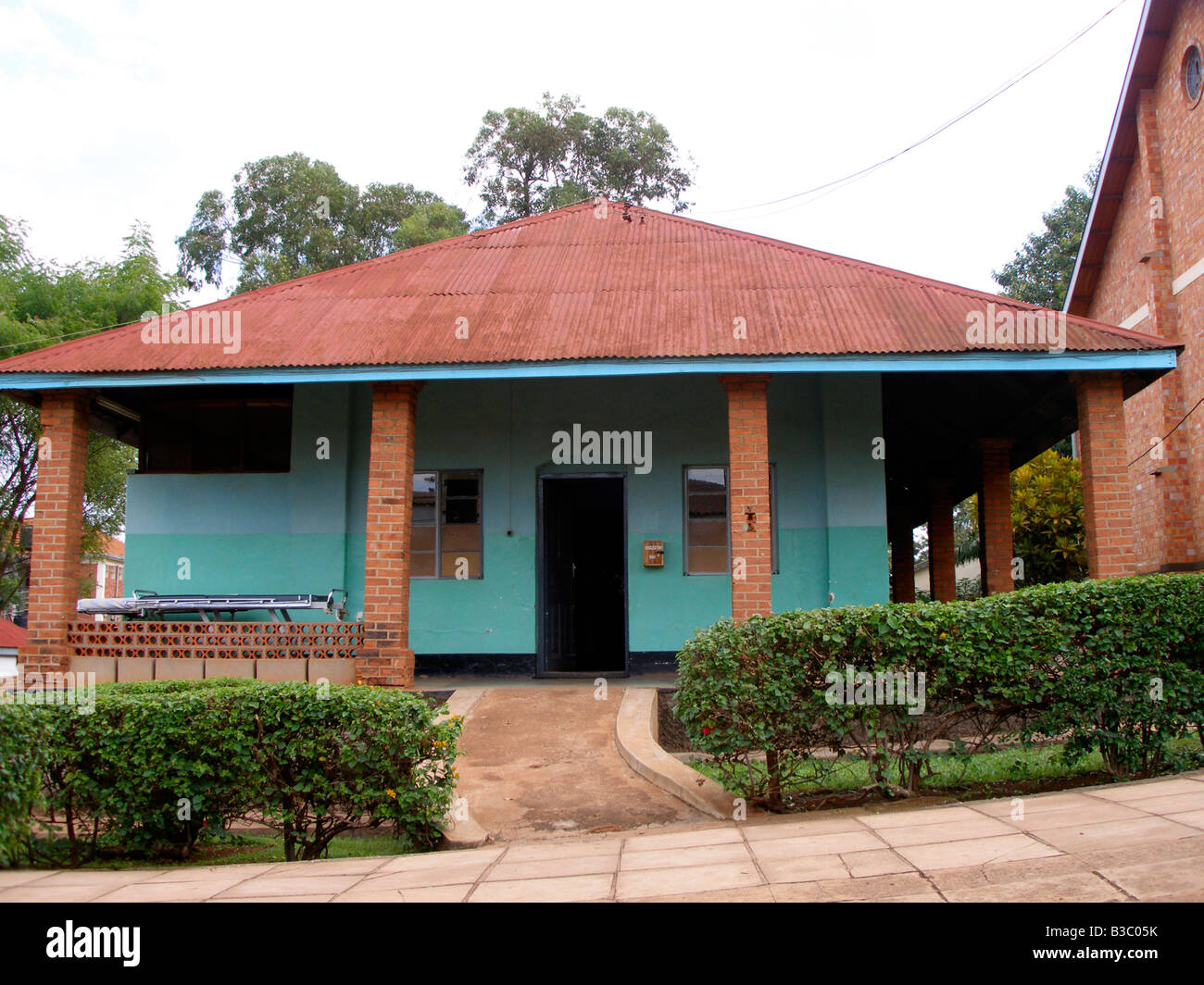 Old colonial style tin roof building in the compound of St. Francis Hospital, Nsambya, Uganda Stock Photo