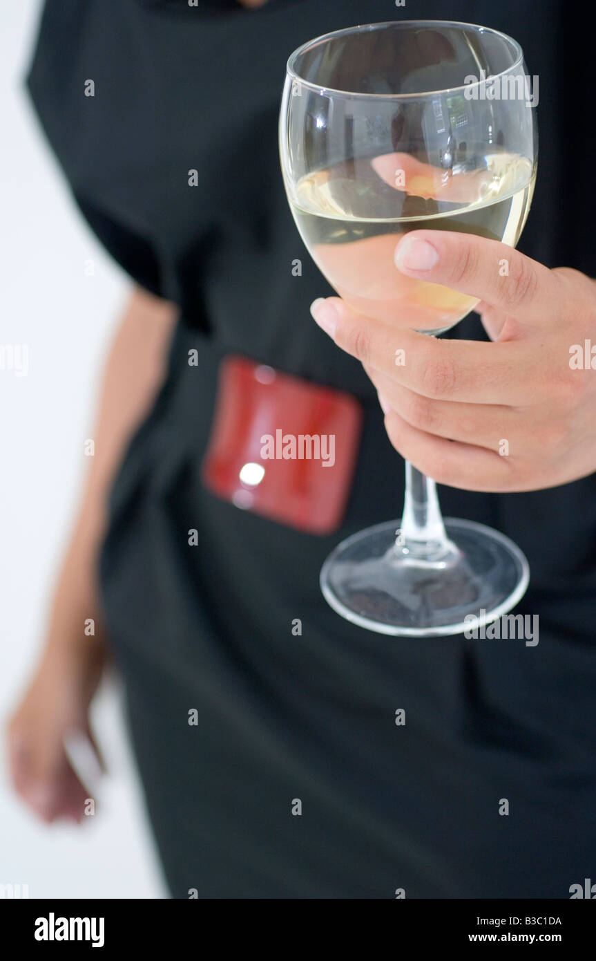 Woman holding glass of wine hi-res stock photography and images - Alamy