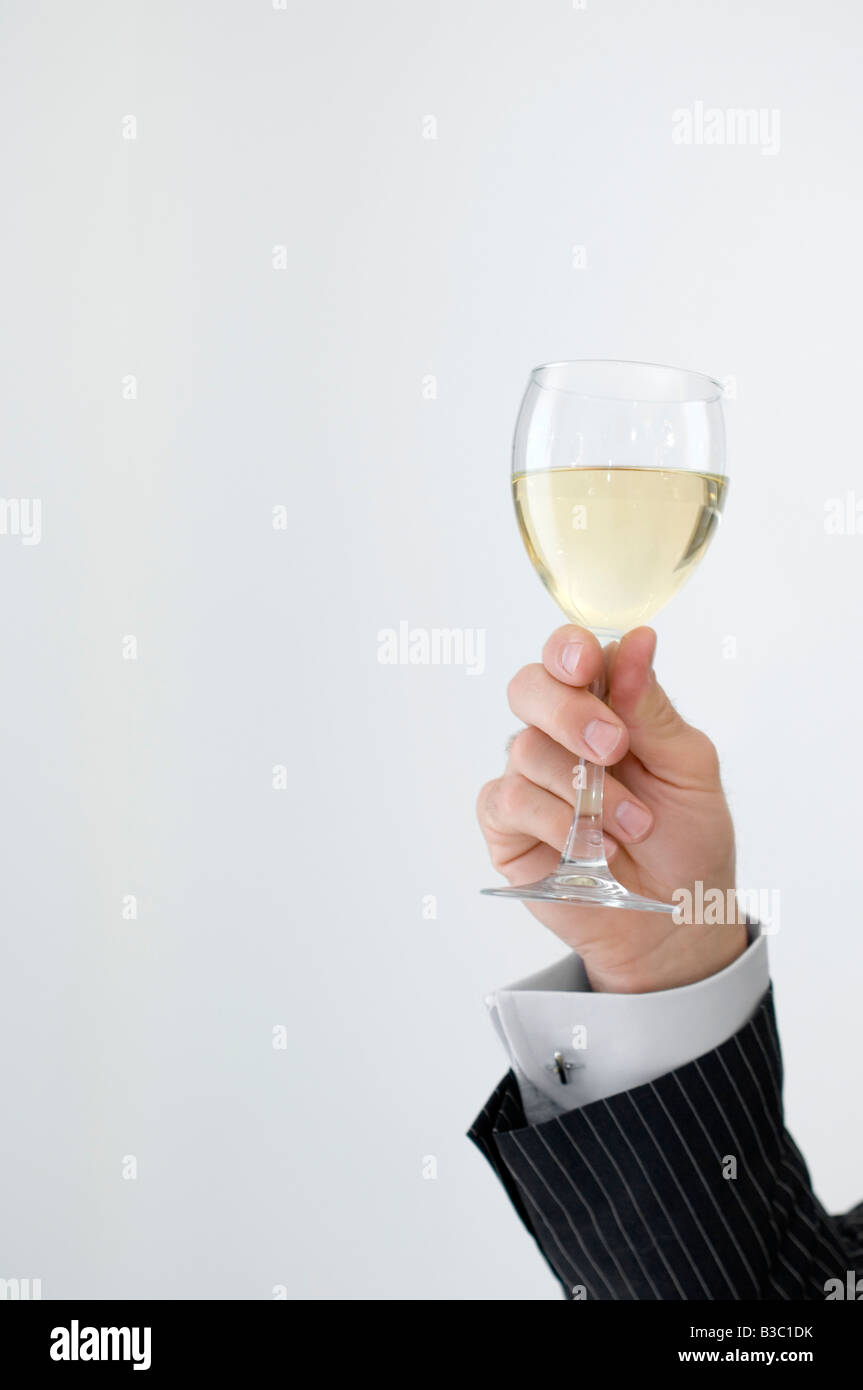 A man holding a wine glass Stock Photo Alamy