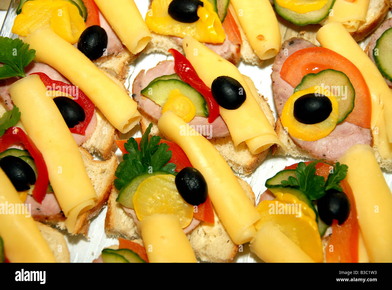 Catering buffet style sandwiches with sausages on lettuce Stock Photo