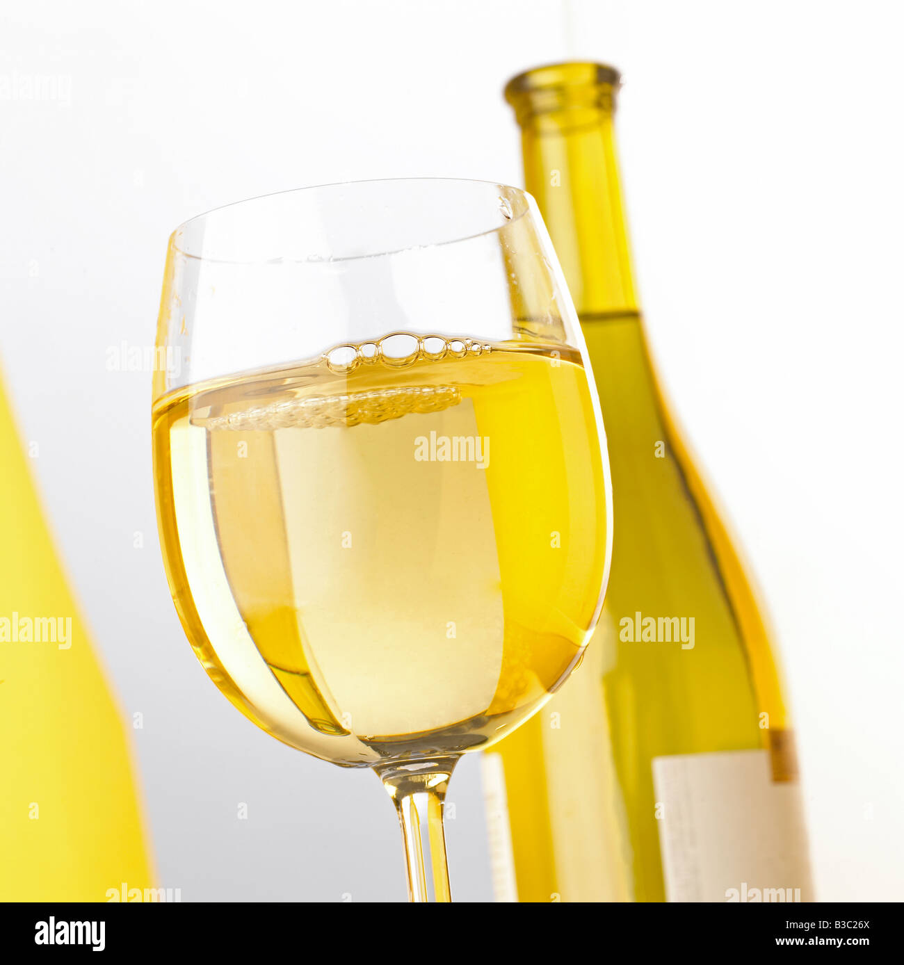 A bottle and glass of white wine Stock Photo