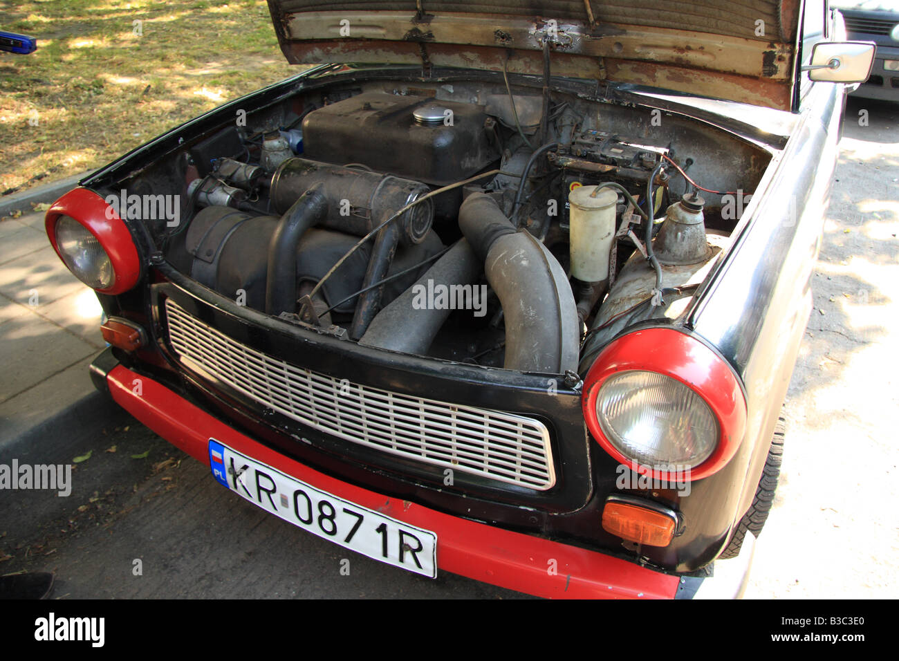 Trabant car, Poland. Bonnet raised to reveal engine of a Trabant car by the roadside in Nowa Huta, near Krakow, Poland Stock Photo