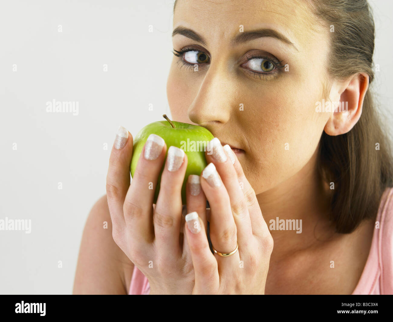 woman smell the freshness of apple Stock Photo Alamy