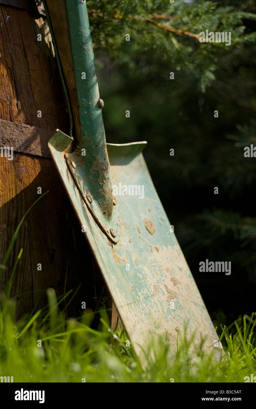 spade leaned on barrel Stock Photo Alamy