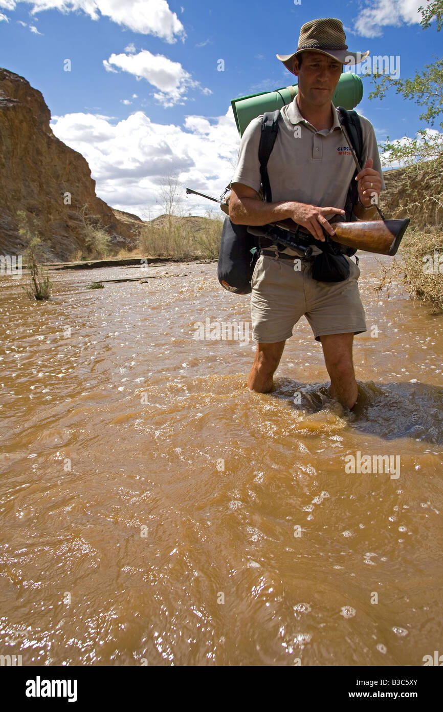 Namibia, Namib Naukluft National Park. The Kuiseb Canyon forms the southern edge of Namib Desert Park. The river flows only occasionally and does not reach the sea. Ex-Game Ranger - Kobus Alberts - armed with a rifle against hyena attack was, with photographer Mark Hannaford, the first person to explore its length. Stock Photo