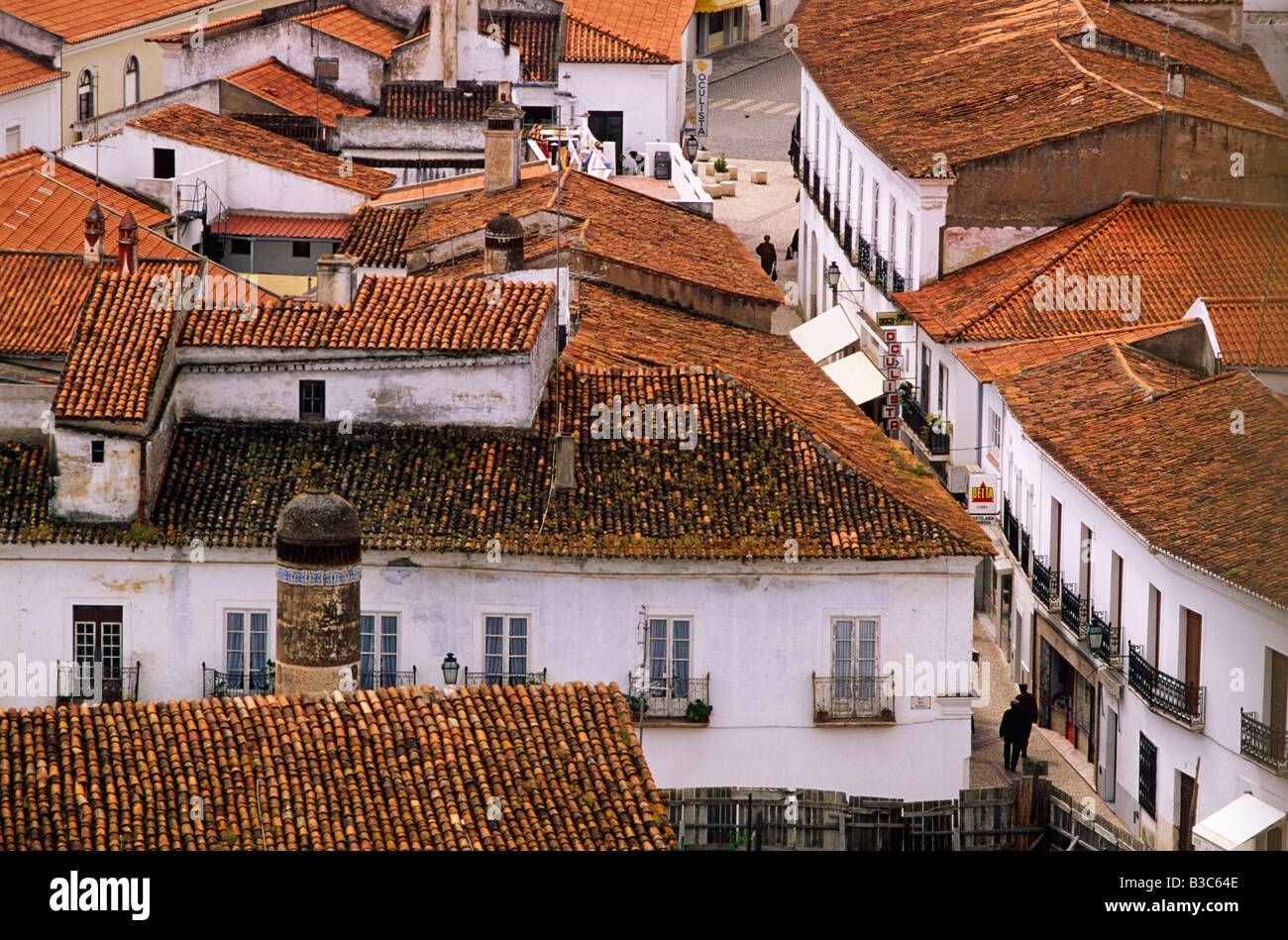 Portugal, Alentejo, Moura. View across the rooftops. The Arab influence is still visible at this peaceful town, surrounded by oaks and olive trees, particularly in the narrow streets and low whitewashed houses, with their pepperpot chimneys, of the Moorish quarter. Stock Photo