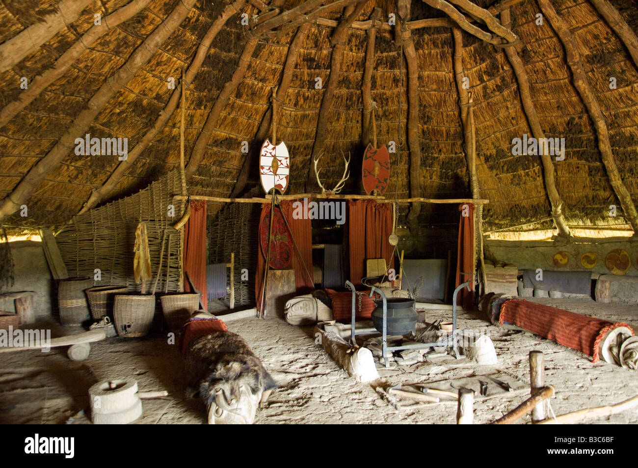 UK, Wales, Pembrokeshire. Interior of the re-created Chieftain's Hut, an Iron Age Celtic Roundhouse Stock Photo