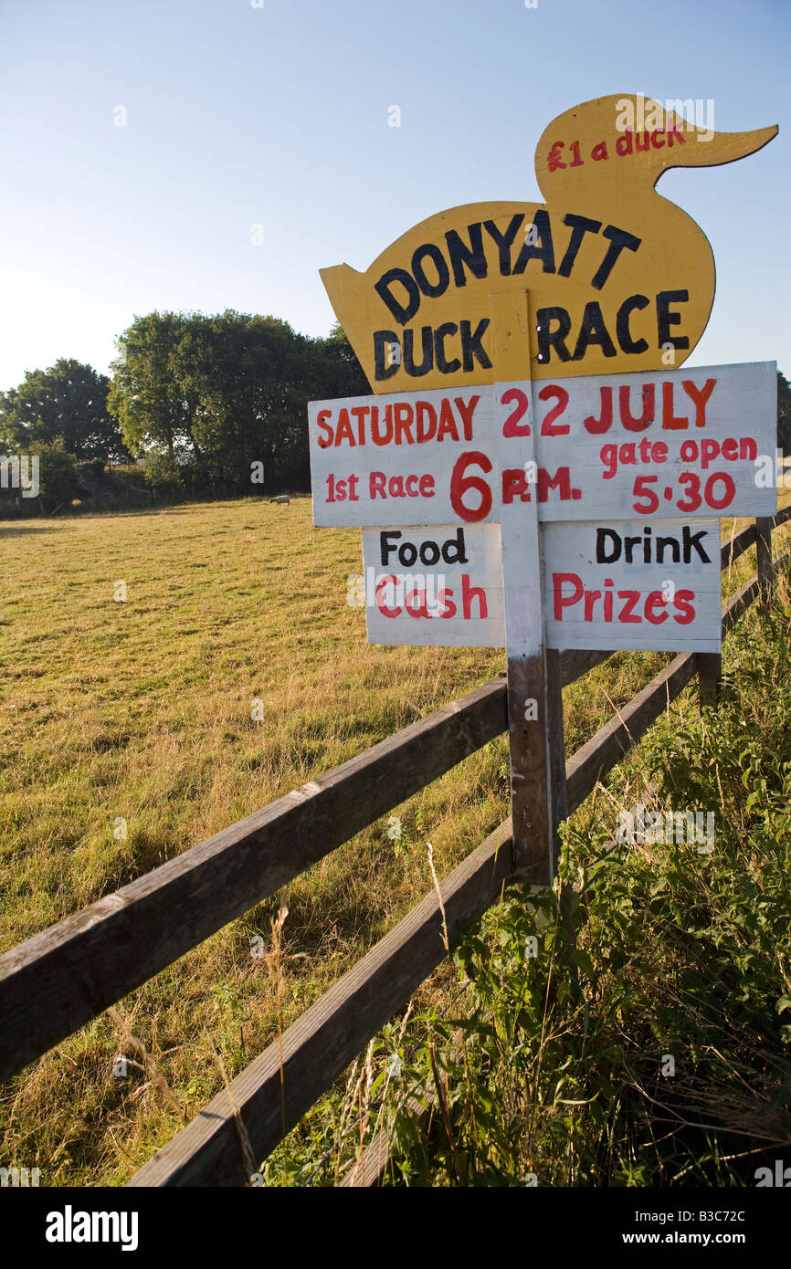 England, Somerset, Donyatt. Road side sign advertising charity duck race - a traditional summer fundraising activity in the area. Stock Photo