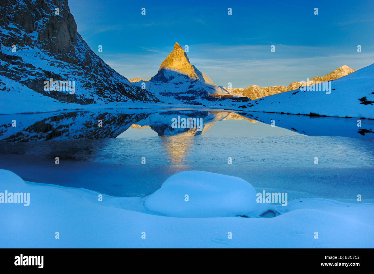 Matterhorn reflected in the Riffelsee Zermatt Valais Switzerland Stock Photo
