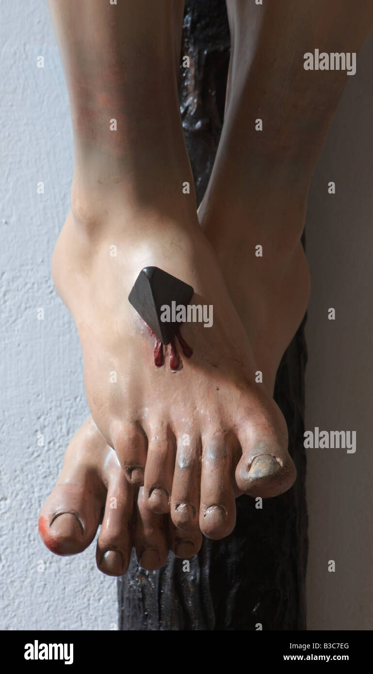 Close up detail of Jesus's feet nailed to cross Stock Photo Alamy