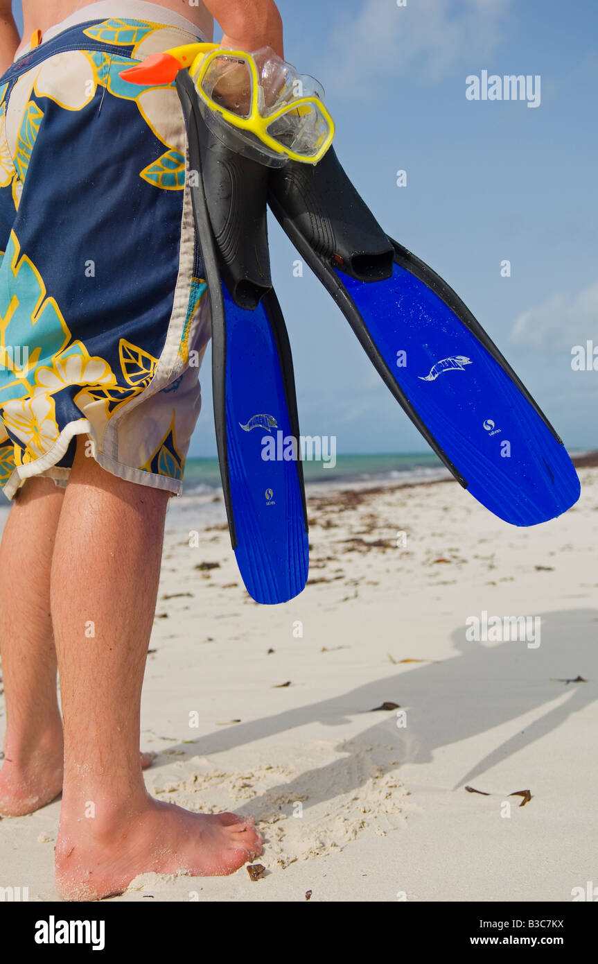 Kenya, Watamu. A boy with snorkel, mask and fins on the beach at Watamu