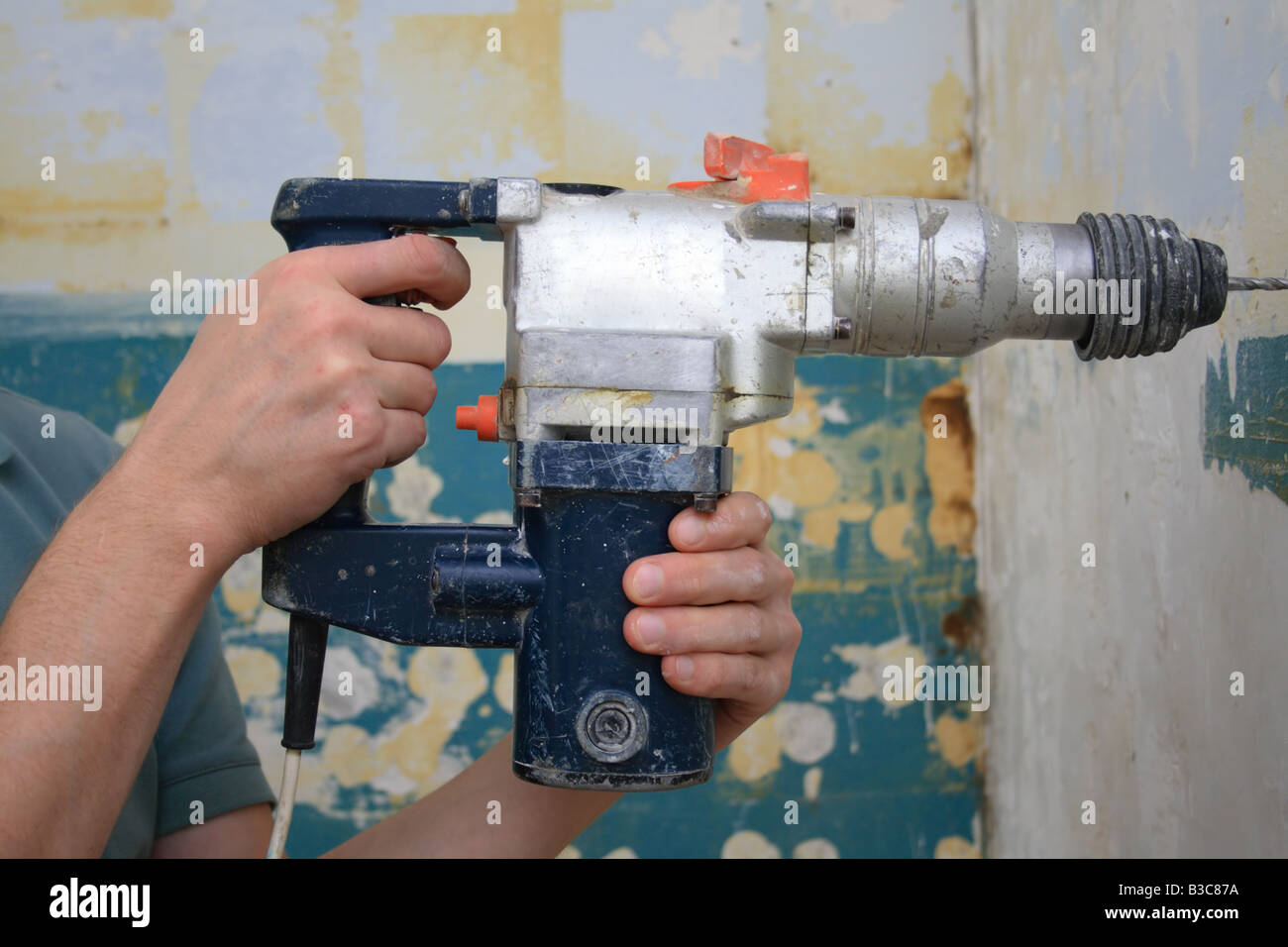 working with a power drill in a house Stock Photo Alamy
