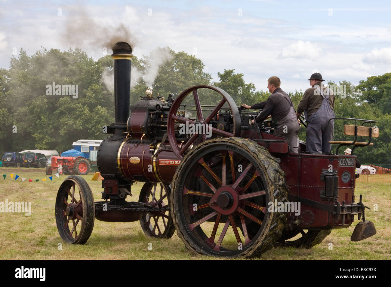 Two men driving a vintage 1915 John Fowler general purpose traction engine Stock Photo