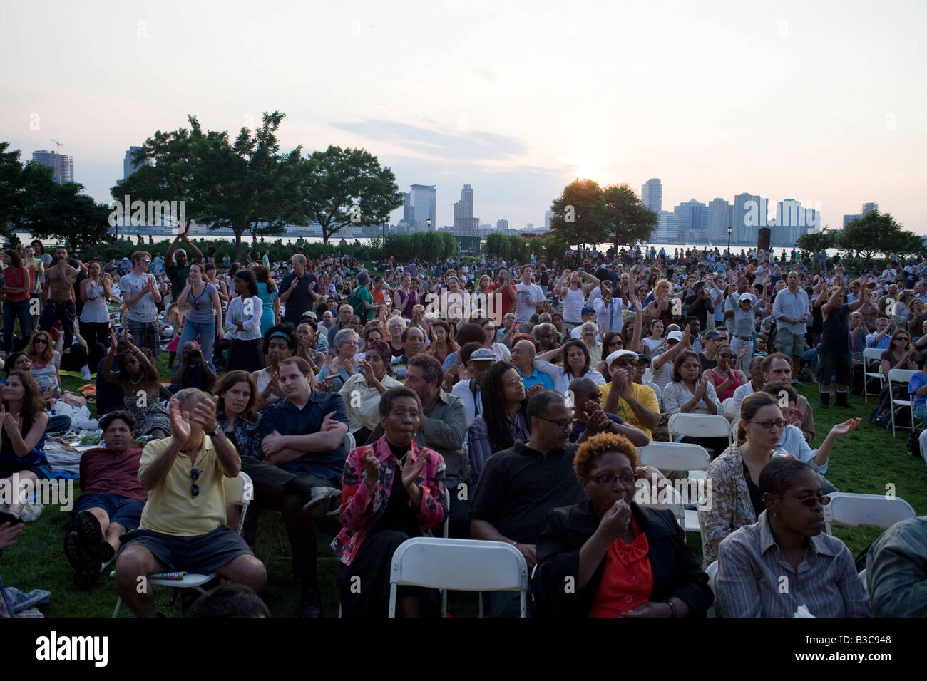 Audience at Rockefeller Park listening to an outdoor concert in New