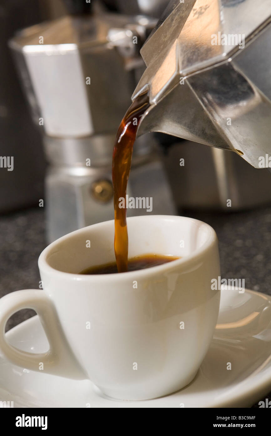 Espresso coffee being made in a stovetop moka pot. Stock Photo