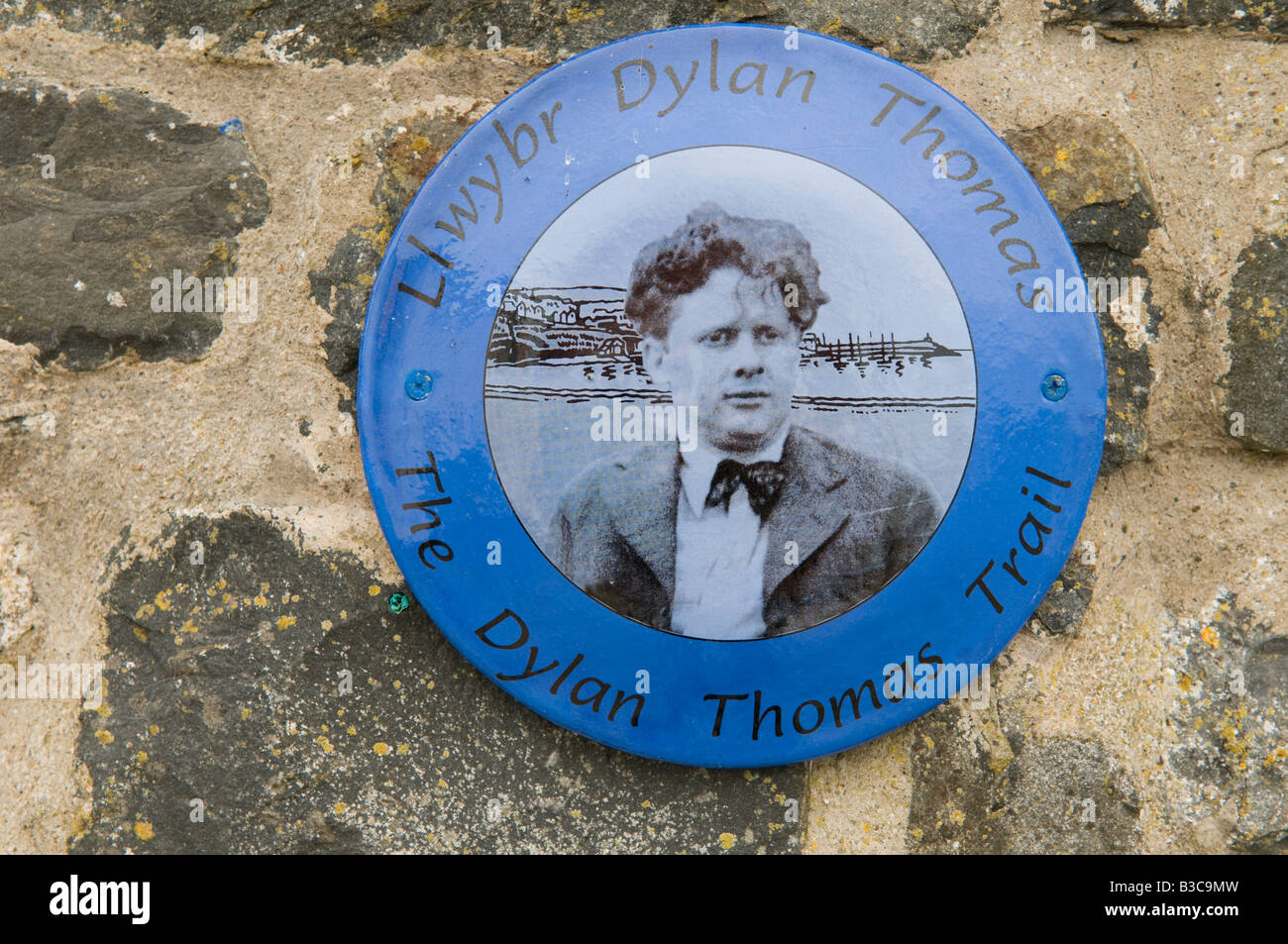 A round Blue wall plaque marking the Dylan Thomas Trail in Aberaeron Ceredigion Wales UK Stock Photo
