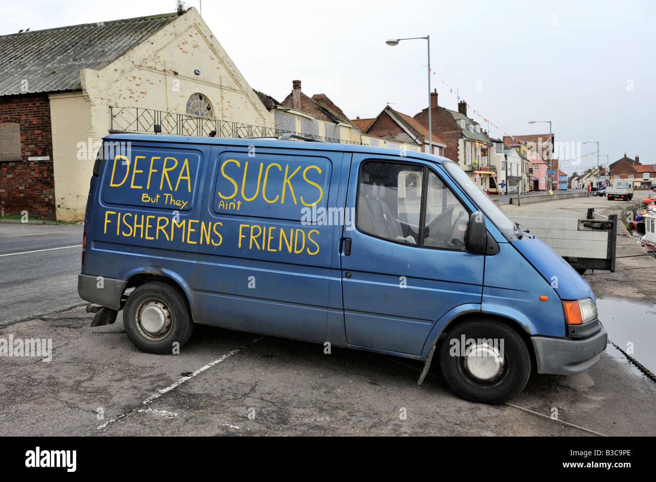 Fishermen's comment on UK Government fishing policy, on side of van at the harbour at Wells-Next-the-Sea, Norfolk Stock Photo
