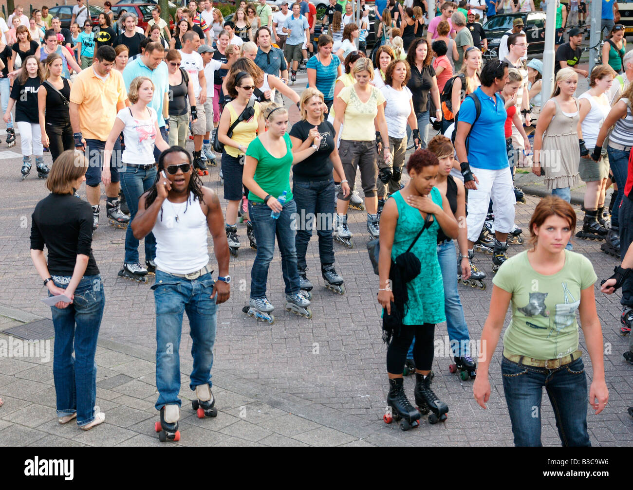 Crowd people roller blade skates inline skating mass action at street