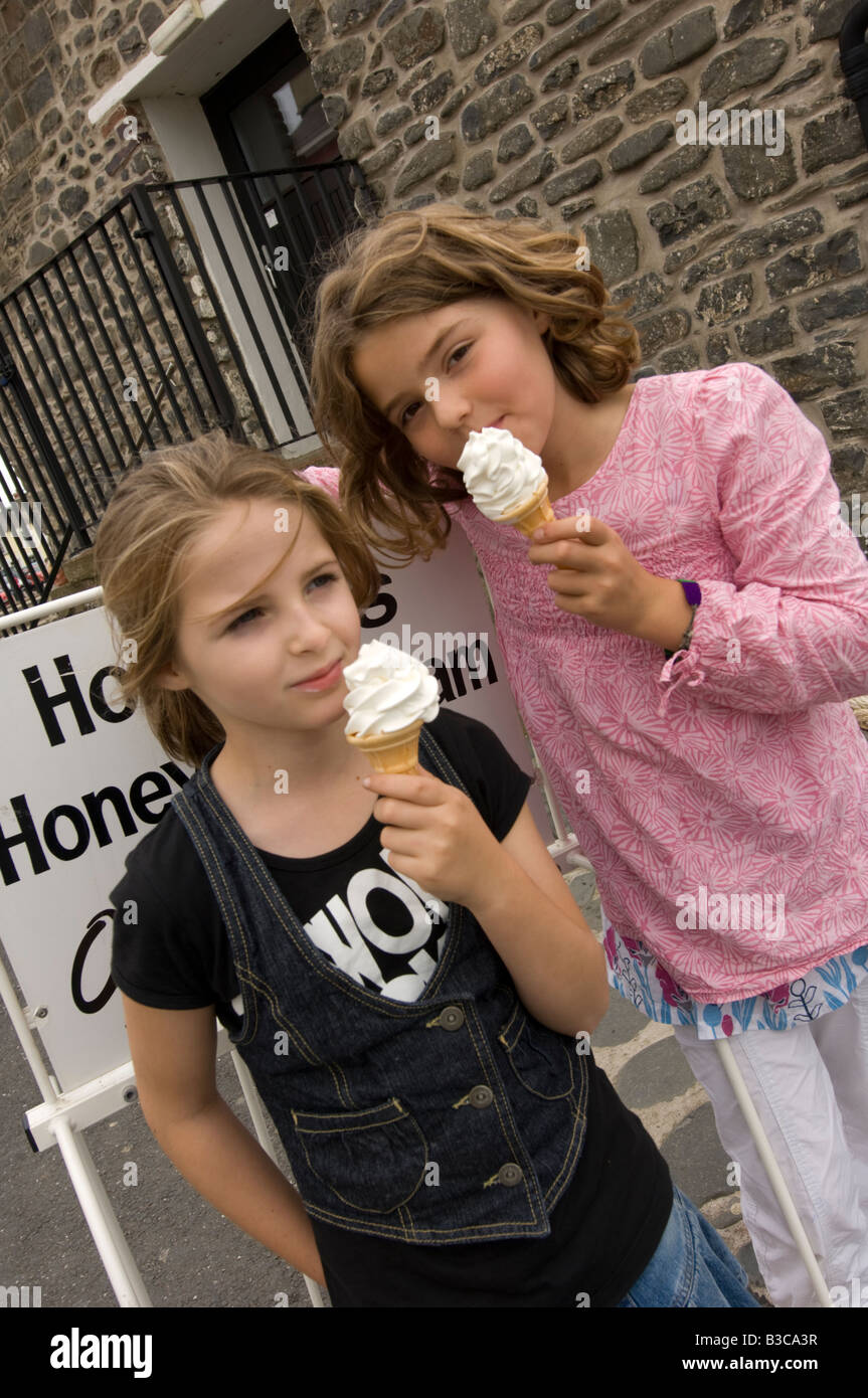 Two Young Welsh Girls On Summer Holiday Vacation Eating Soft Ice Cream