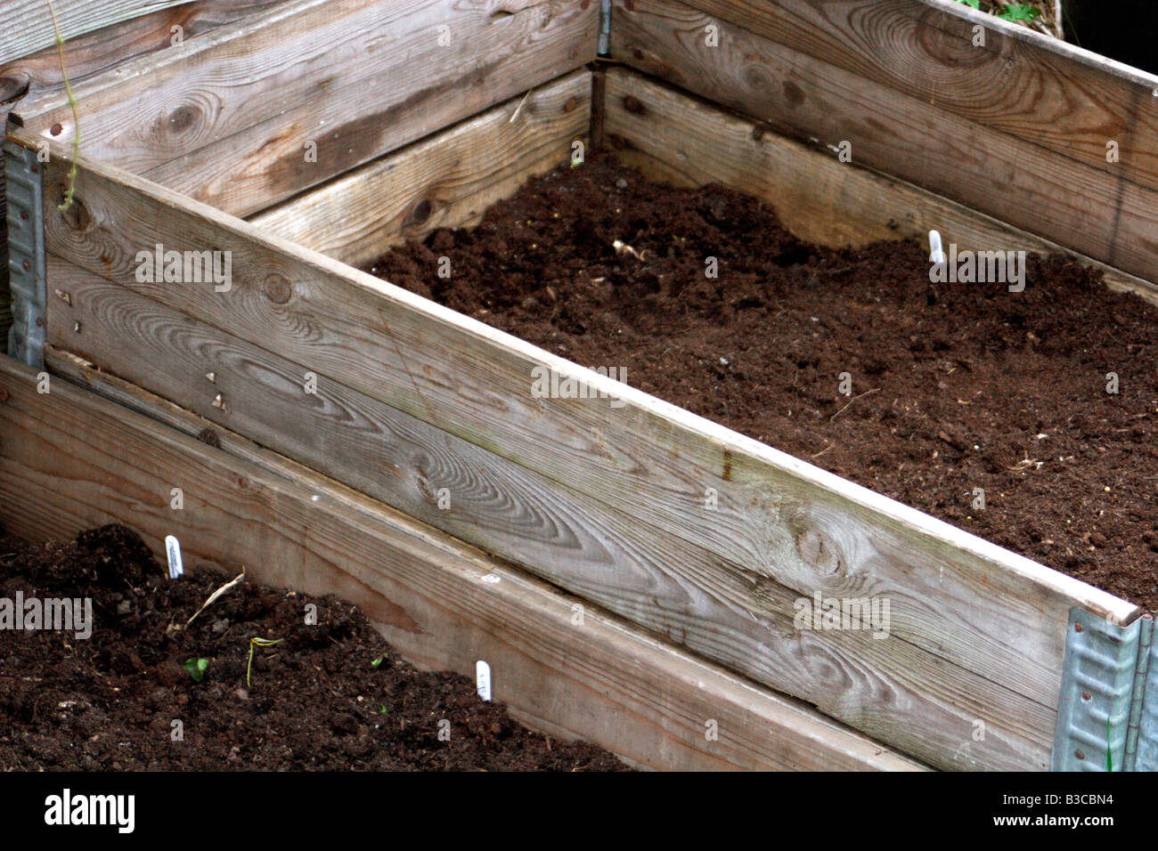 Raised vegetable bed made from old interlocking crates Stock Photo