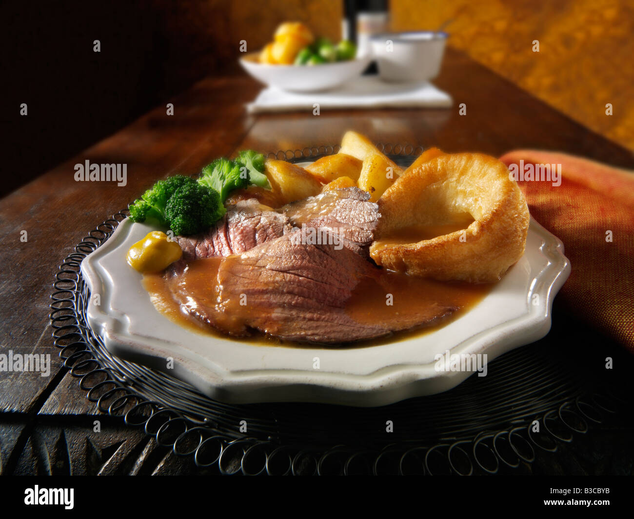 Traditional British roast dinner with roast beef, roast potatoes