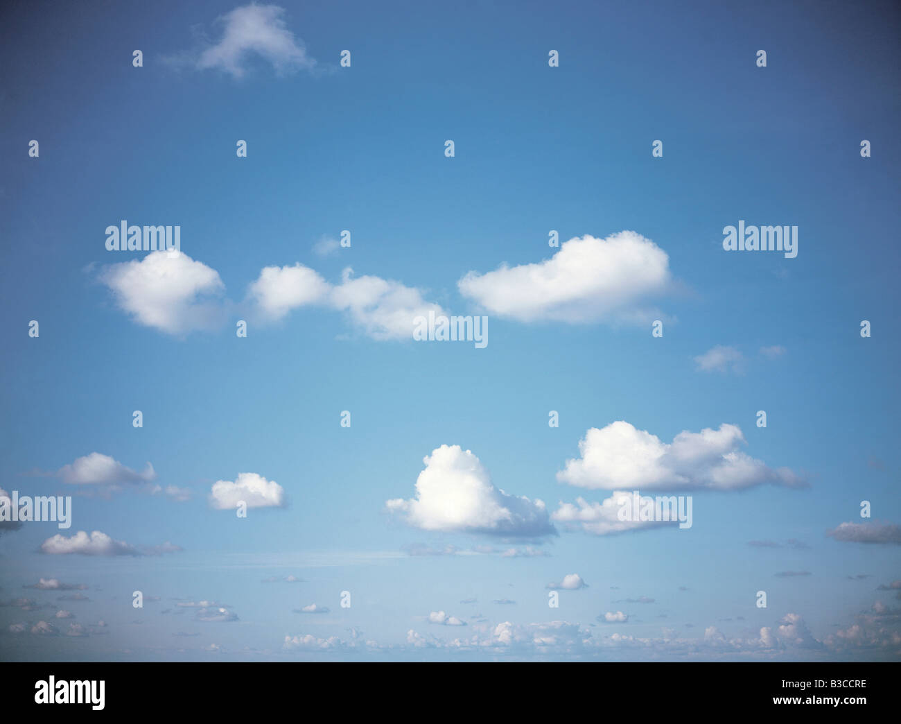 Blue sky with white cumulus clouds. Alderney. Channel Islands. Stock Photo