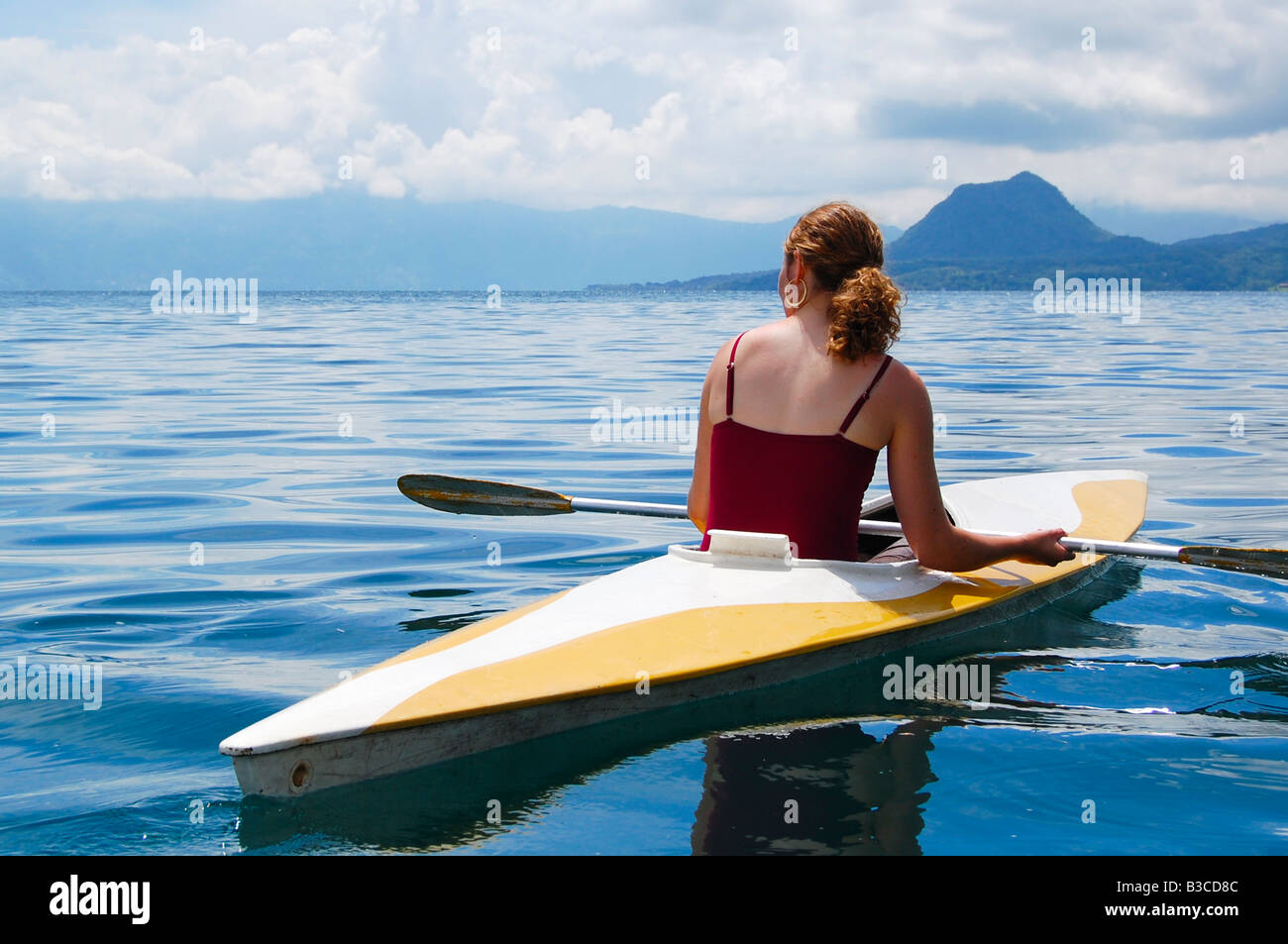 Woman in kayak on Lake Atitlan Stock Photo