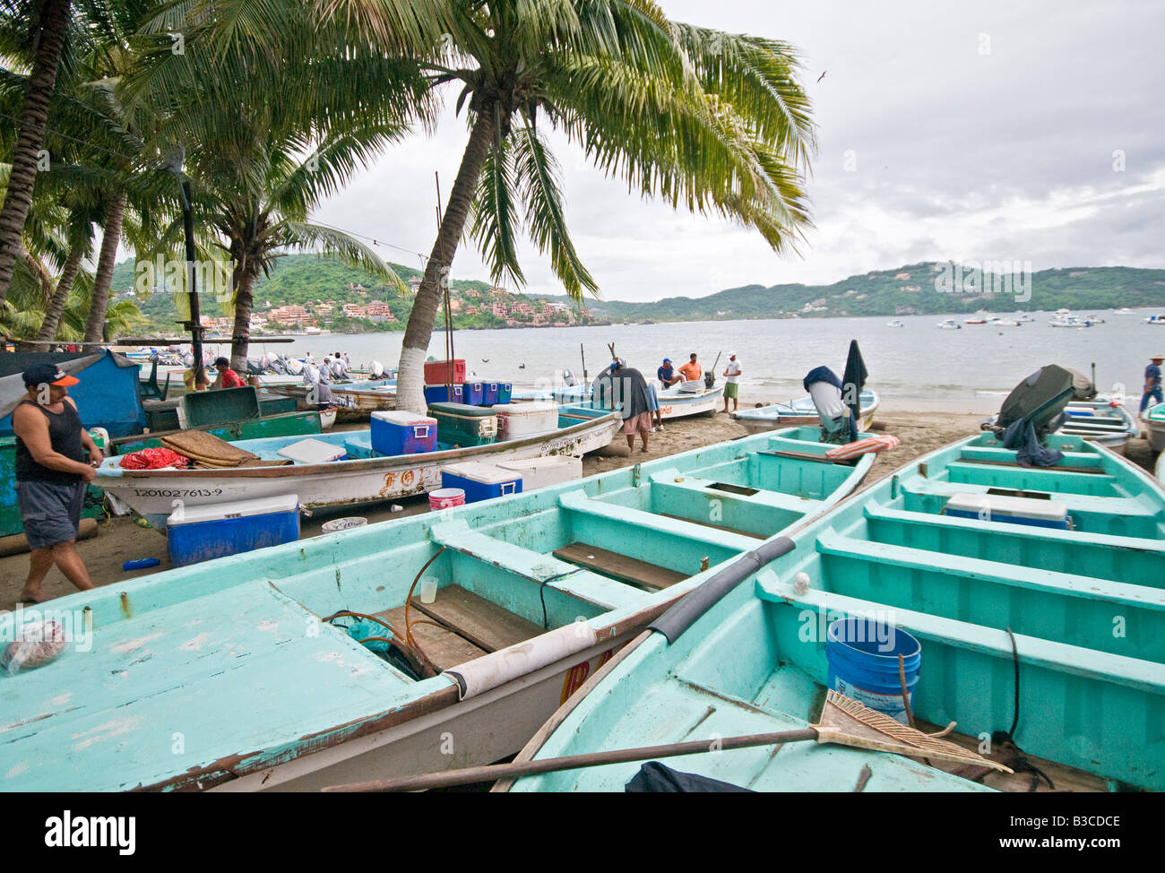 ZIHUATANEJO, Mexico - The fish market on the beach at Playa Principal, Zihuatanejo, Mexico. When the local fisherman return about dawn, they sell their catches at a beach fish market to early morning buyers. Being a traditional fishing village, the seafood in Zihuatanejo is superb. Stock Photo