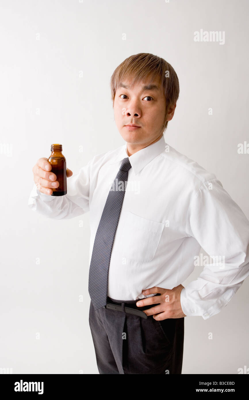 Mid adult man drinking energy drink Stock Photo Alamy