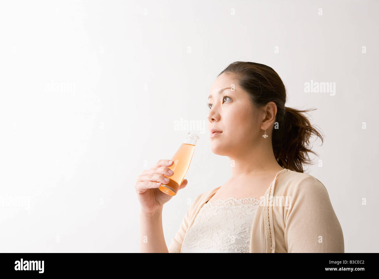 Mid adult woman drinking energy drink Stock Photo Alamy