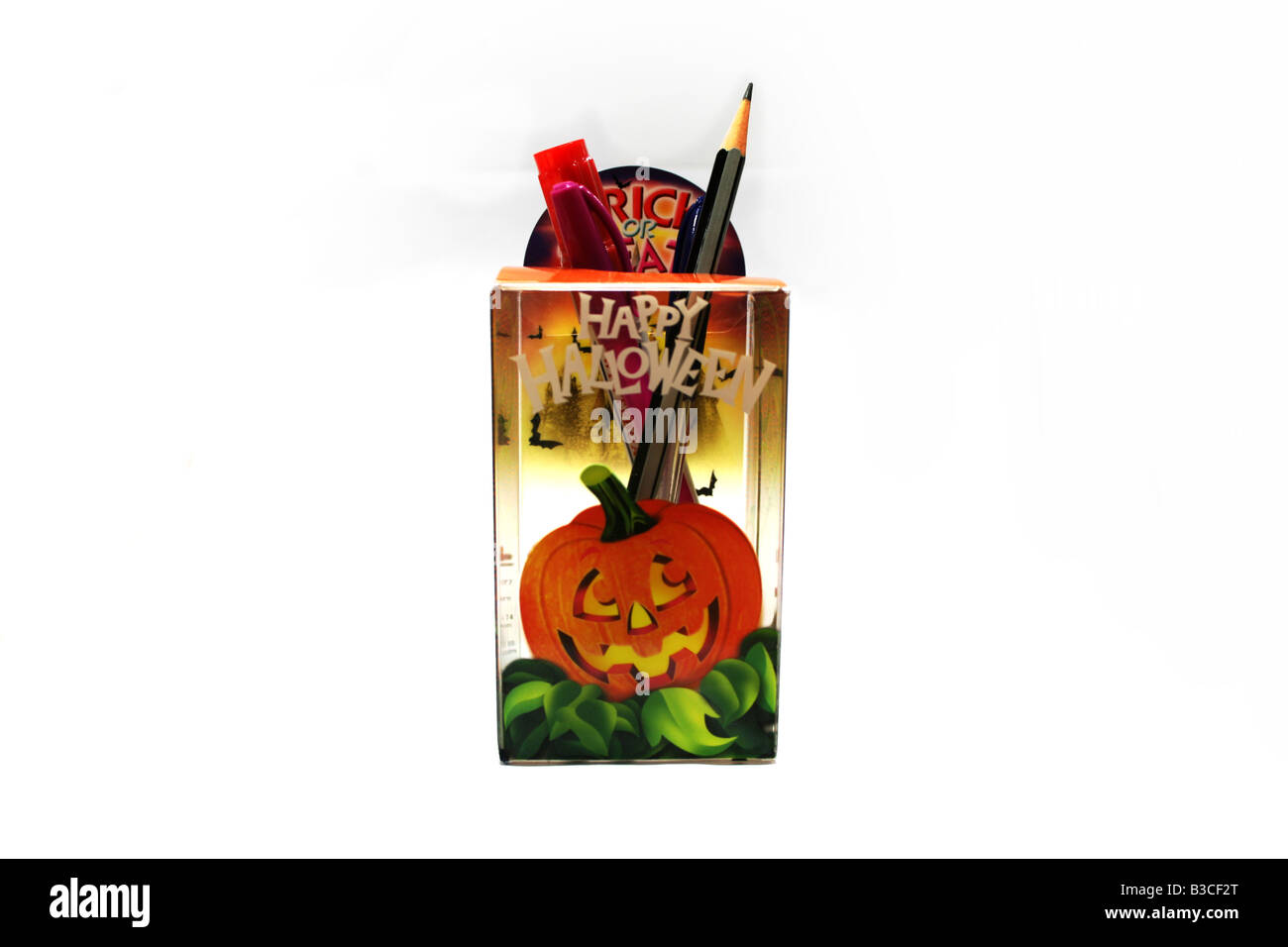 Trick or treat happy halloween stationery holder with picture of a smiling pumpkin for children & adults at home or office use Stock Photo