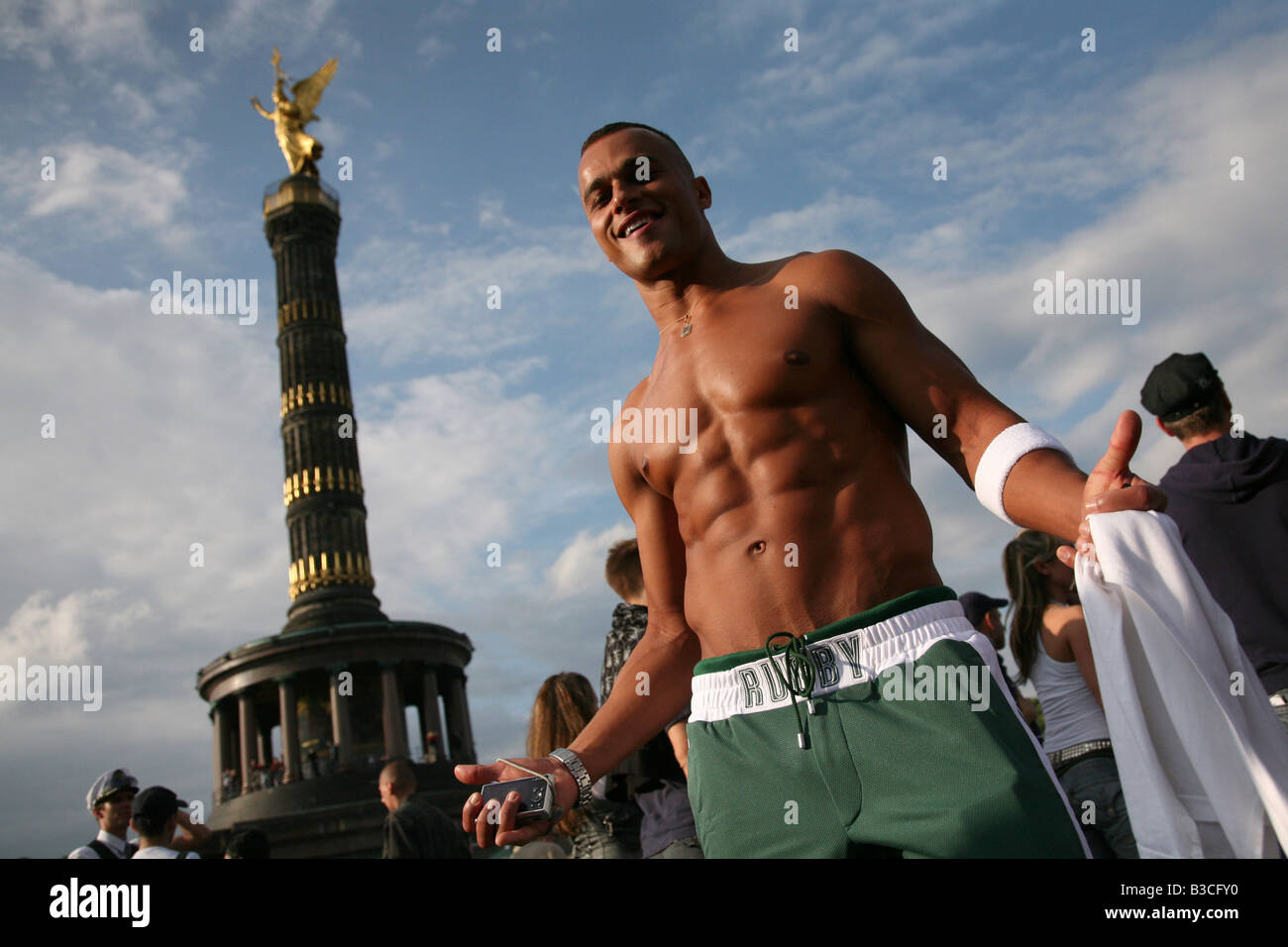 Muscular boy in front of the Victory Column during the Christopher Street Day Pride in Berlin, Germany Stock Photo
